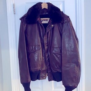 Schott Bomber. No rips or tears. Cuffs look new. Zipper merge a bit loose.